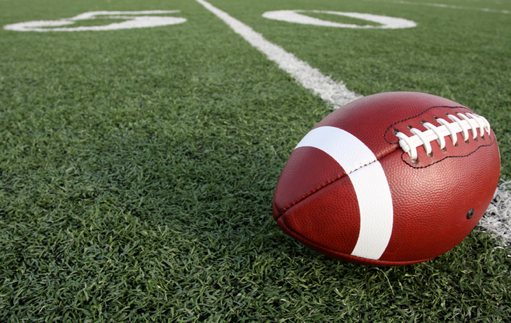 Close-Up Of American Football On Field